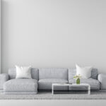 Gray sofa in white living room interior with copy space, 3D rendering